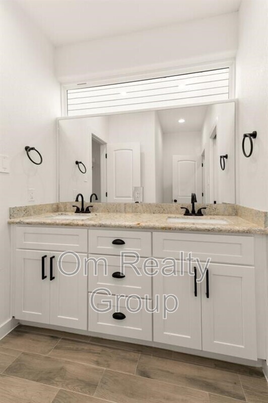 4705 Idaho Street Houston, TX 77021 - Photo 4 of 13 a bathroom with a sink mirror and vanity