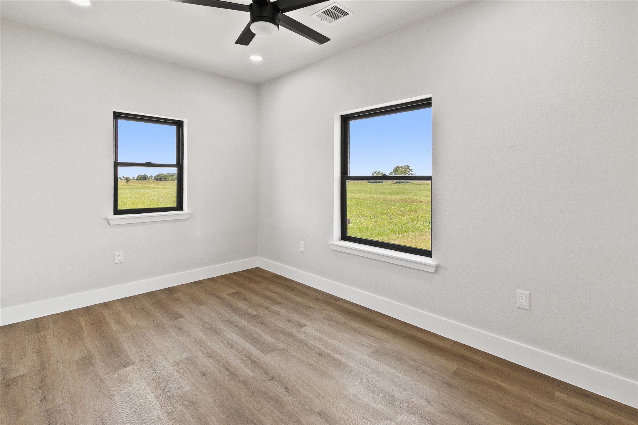 619 Chuckwagon Trail Angleton, TX 77515 - Photo 31 of 37 Additional secondary bedroom located near the full guest bathroom, offering flexibility for guests, hobbies, or everyday living. Includes a closet and ample natural light.