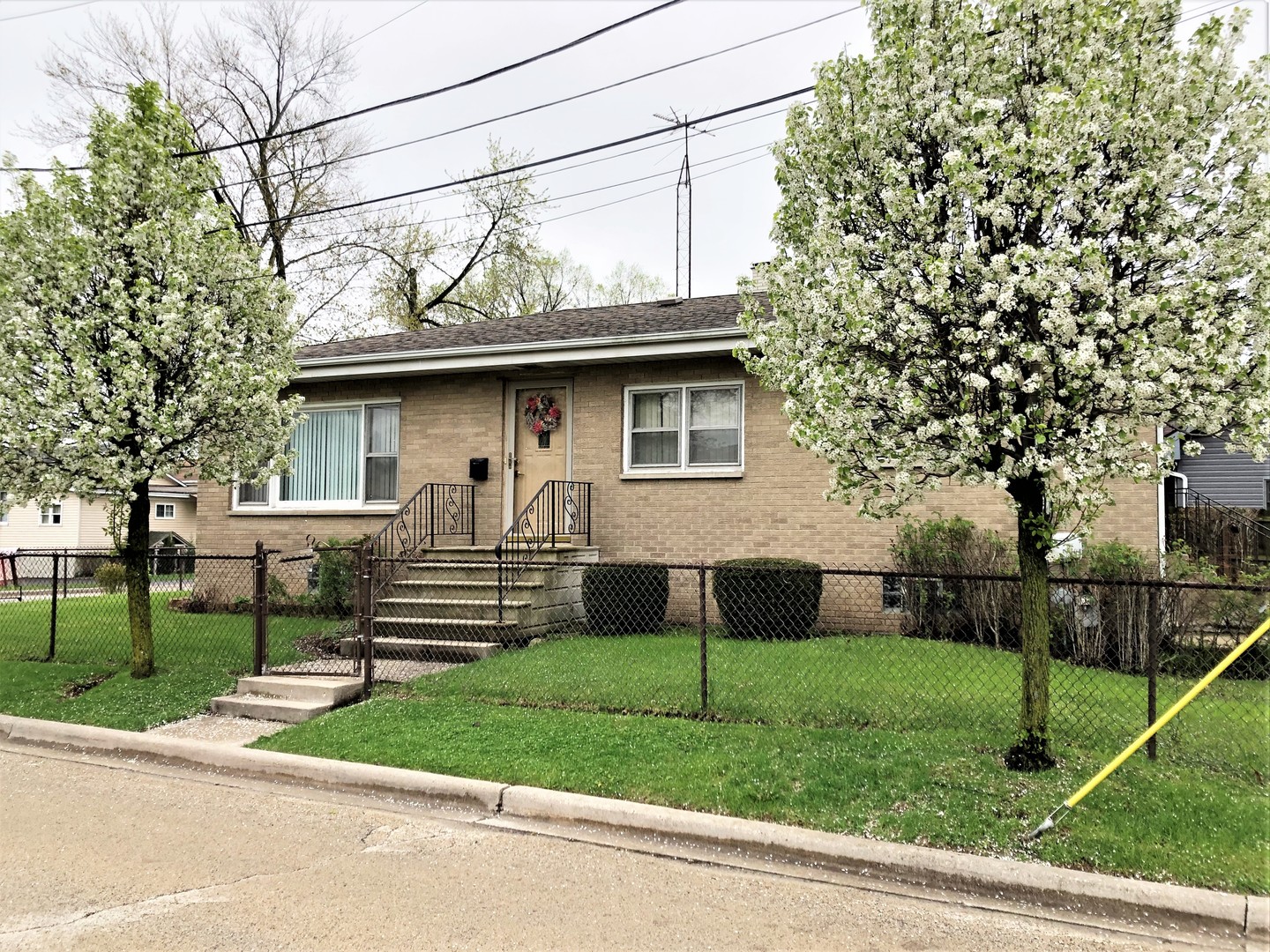715 Water Street Joliet, IL 60436 - Photo 3 of 21 a front view of a house with a yard