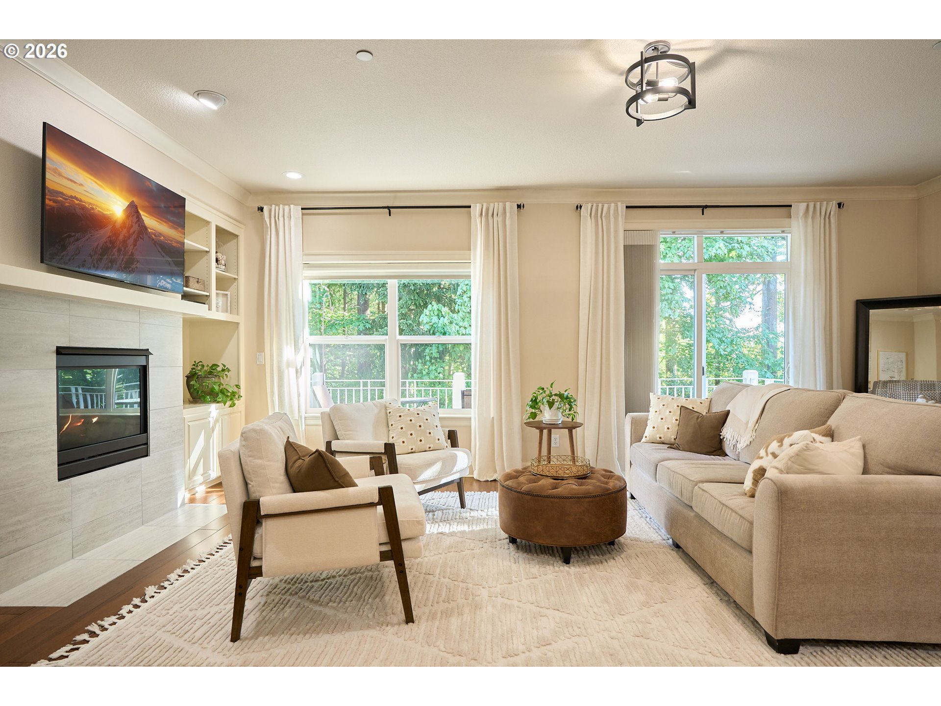 2120 Northwest Fargo Loop Camas, WA 98607 - Photo 12 of 42 a living room with furniture a flat screen tv and a large window