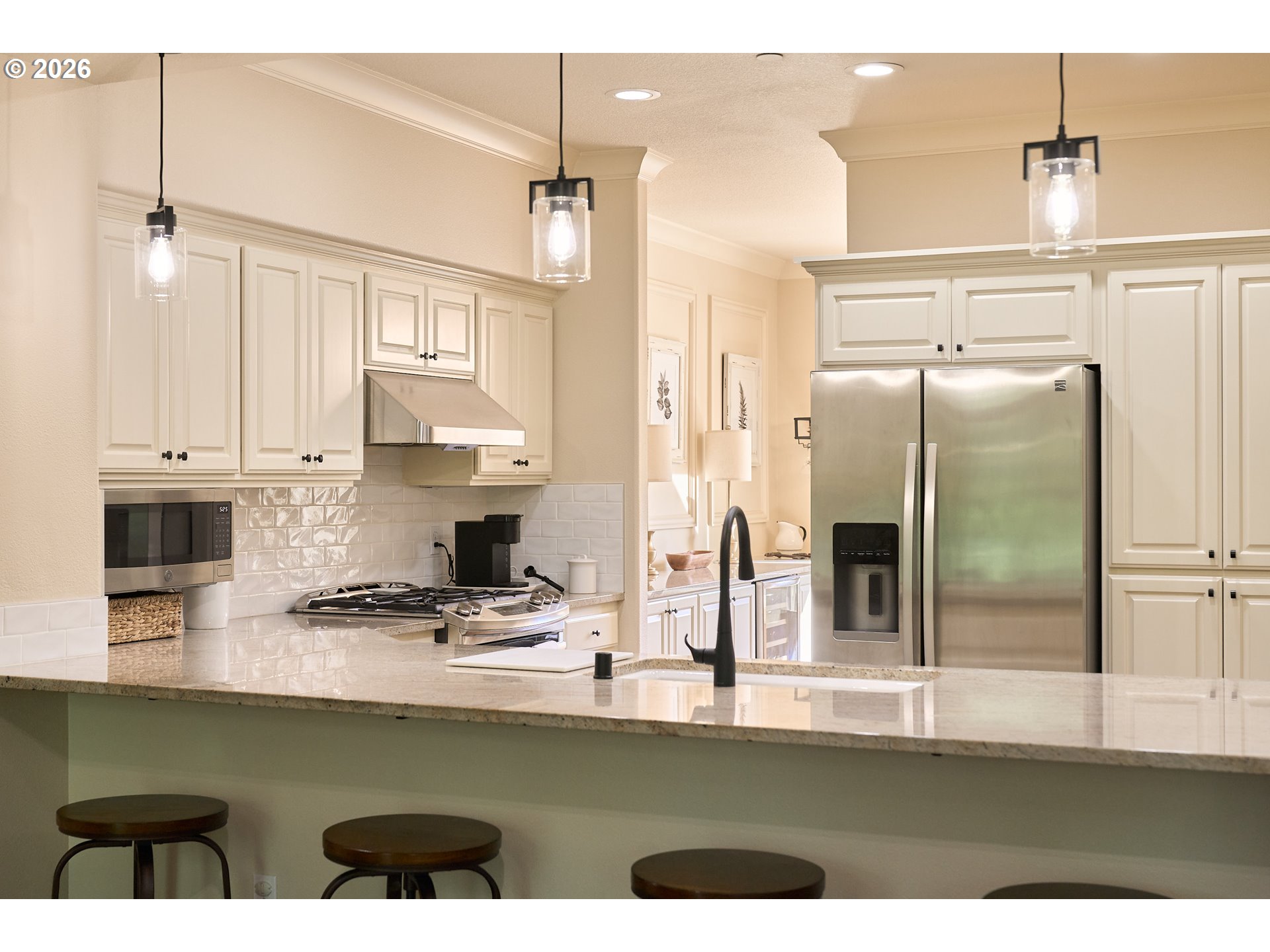 2120 Northwest Fargo Loop Camas, WA 98607 - Photo 20 of 42 a kitchen with stainless steel appliances granite countertop a refrigerator a stove and a sink