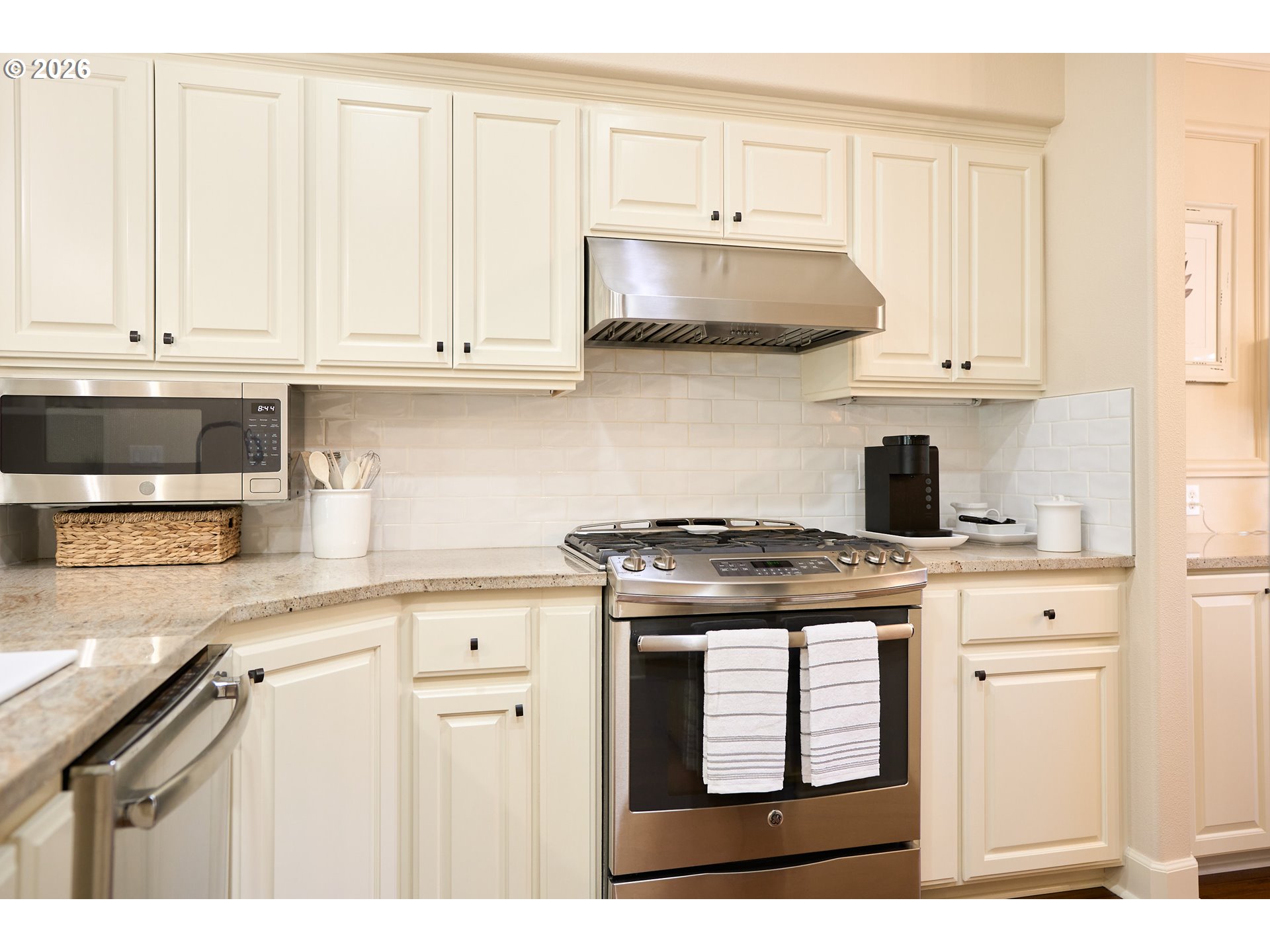 2120 Northwest Fargo Loop Camas, WA 98607 - Photo 22 of 42 a kitchen with stainless steel appliances granite countertop a stove and white cabinets