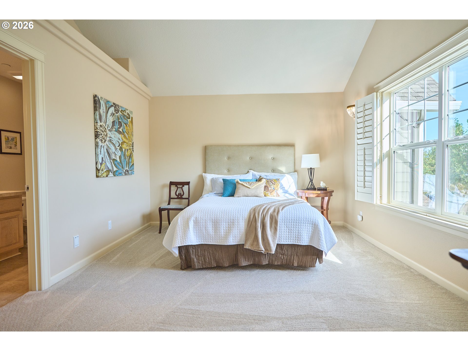 2120 Northwest Fargo Loop Camas, WA 98607 - Photo 38 of 42 a spacious bedroom with a bed and wooden floor