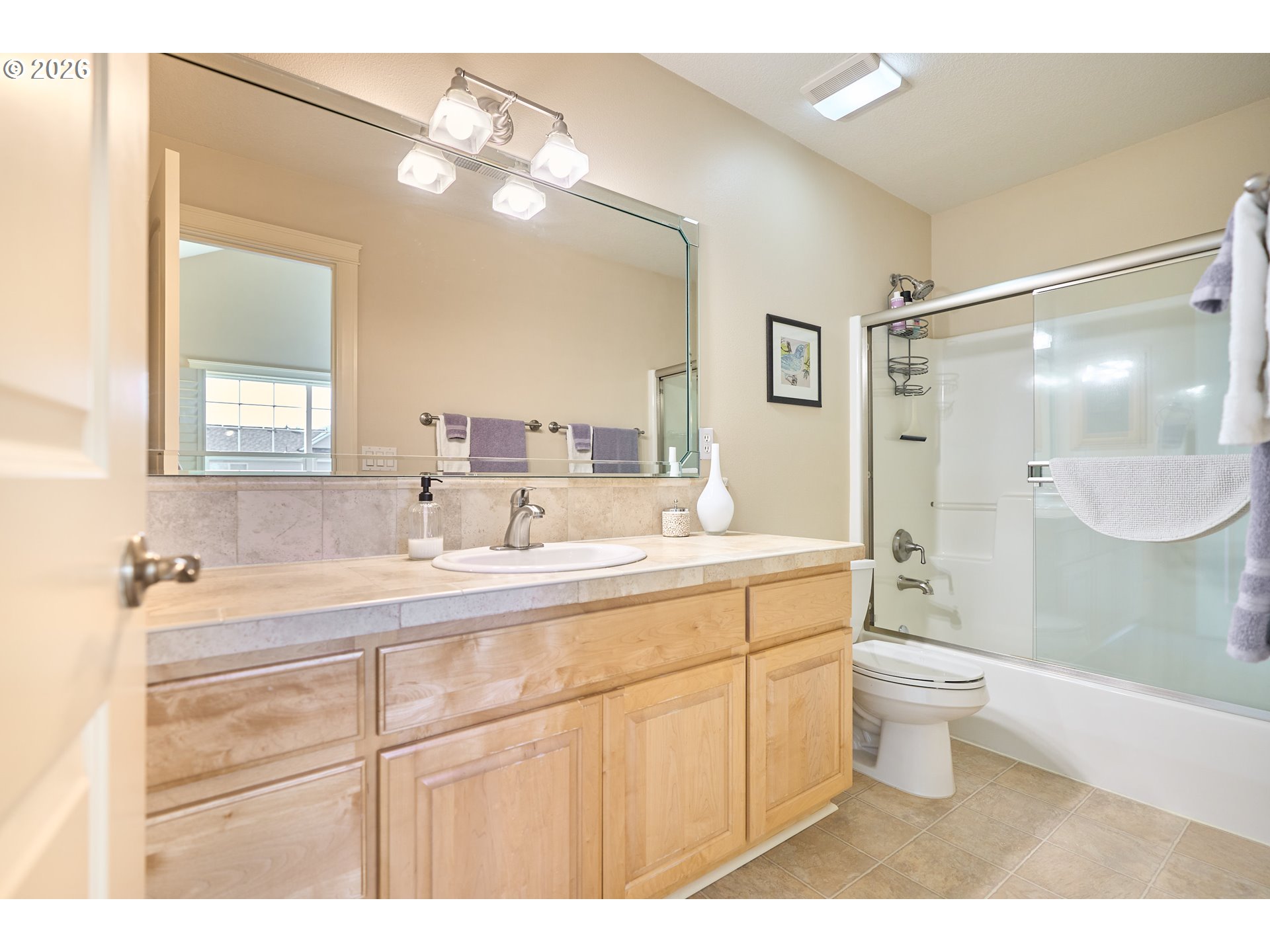 2120 Northwest Fargo Loop Camas, WA 98607 - Photo 39 of 42 a bathroom with a sink a toilet a shower and a mirror