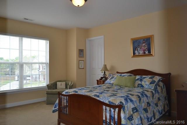 408 Lafinca Court Fort Mill, SC 29708 - Photo 11 of 20 a bedroom with a bed and a window