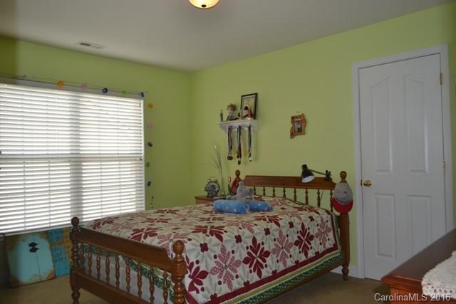 408 Lafinca Court Fort Mill, SC 29708 - Photo 13 of 20 a bedroom with a bed and a window