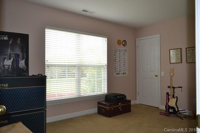 408 Lafinca Court Fort Mill, SC 29708 - Photo 16 of 20 a living room with a window and a couch