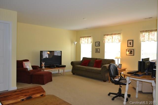 408 Lafinca Court Fort Mill, SC 29708 - Photo 17 of 20 a livingroom with workspace and a couch