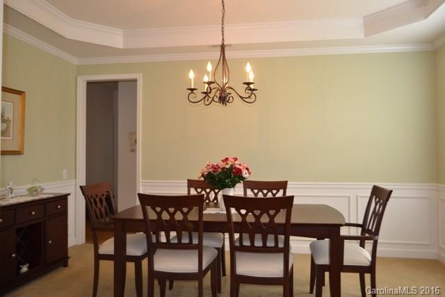 408 Lafinca Court Fort Mill, SC 29708 - Photo 3 of 20 a view of a dining room with furniture and chandelier
