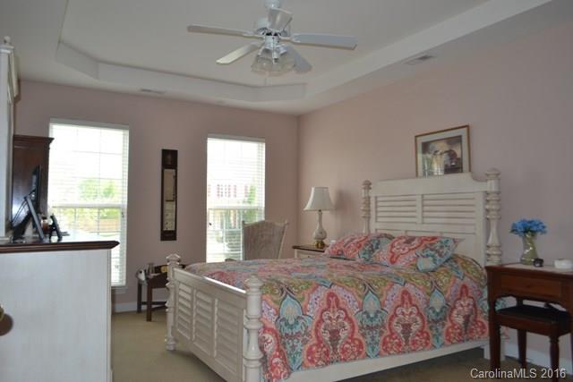 408 Lafinca Court Fort Mill, SC 29708 - Photo 8 of 20 a bedroom with a bed and a table