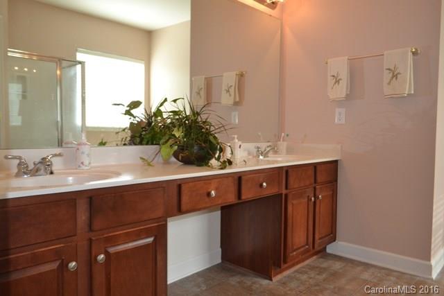 408 Lafinca Court Fort Mill, SC 29708 - Photo 9 of 20 a bathroom with a double vanity sink and mirror