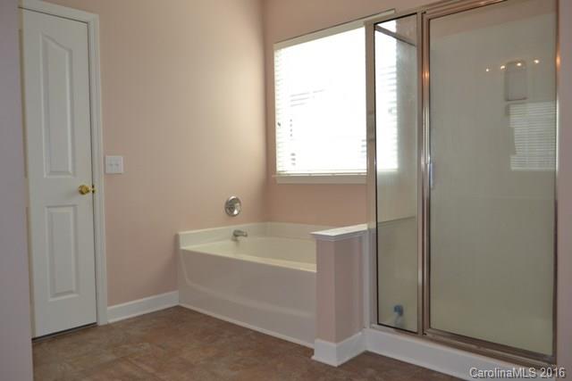 408 Lafinca Court Fort Mill, SC 29708 - Photo 10 of 20 a bathroom with a bathtub and a shower