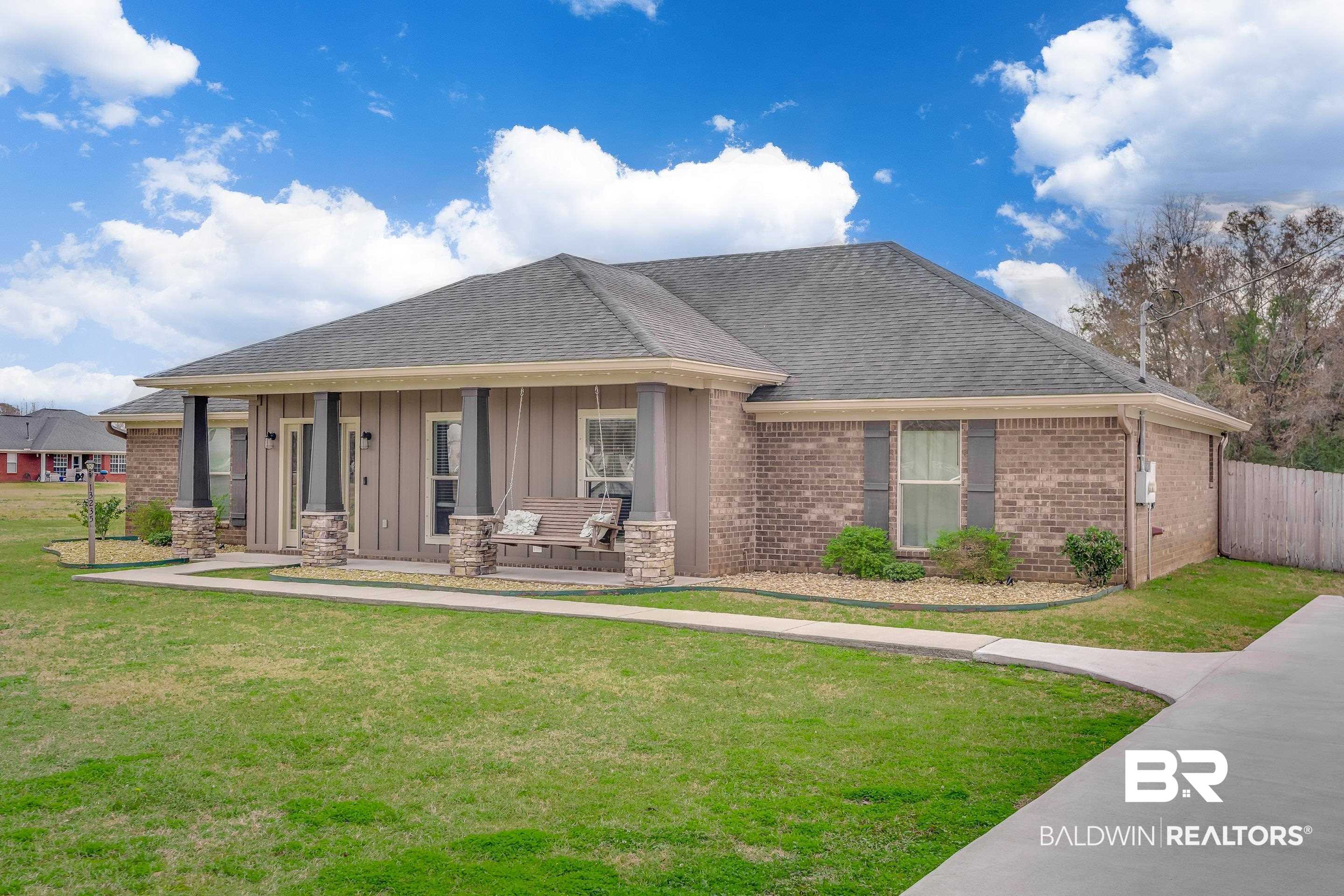 13235 Tom Gaston Road Mobile, AL 36695 - Photo 39 of 43 View of front of house with a front lawn and a porch