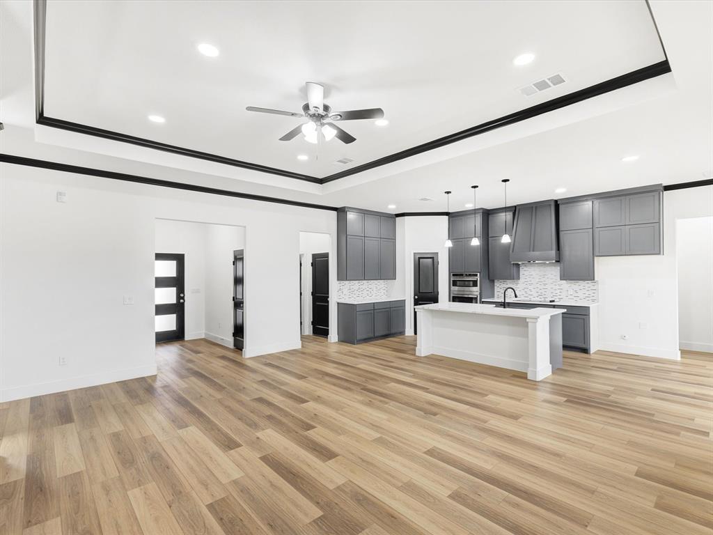 544 Shepherd Road Combine, TX 75159 - Photo 19 of 36 a view of a kitchen with a sink and refrigerator