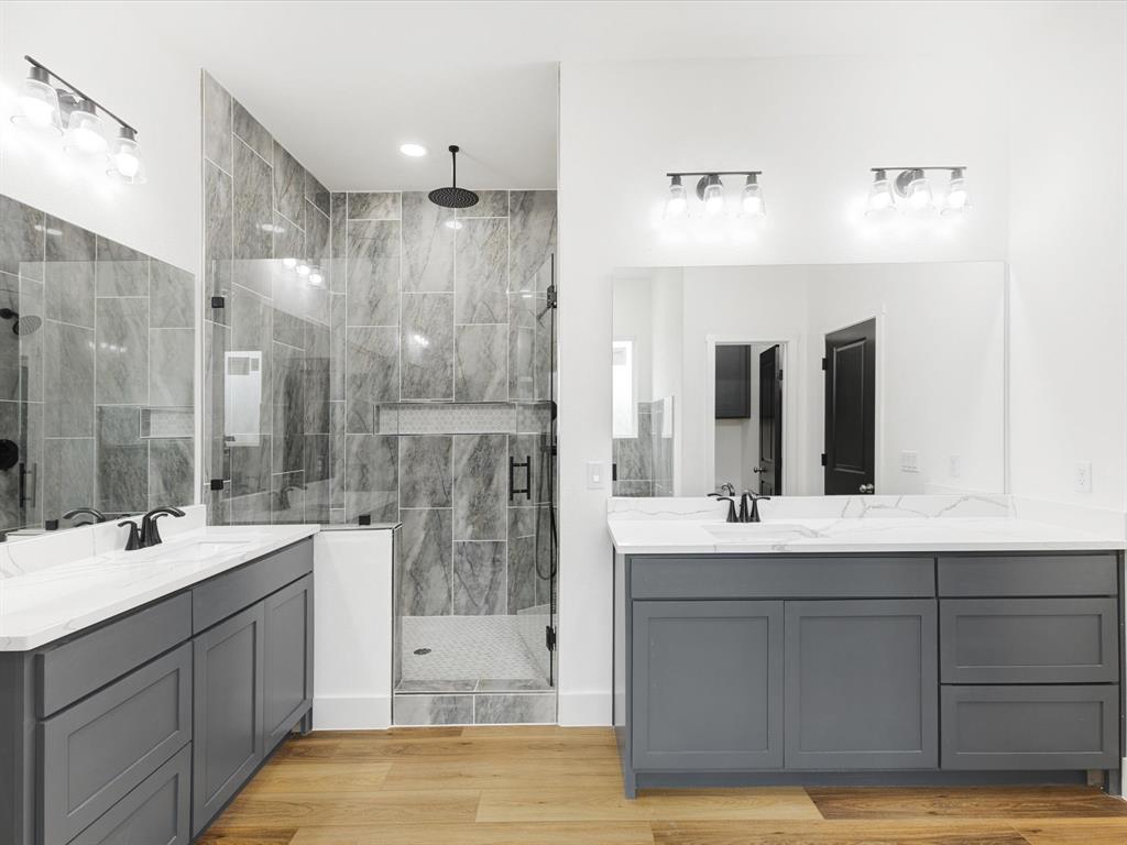 544 Shepherd Road Combine, TX 75159 - Photo 23 of 36 a bathroom with a double vanity sink mirror and shower