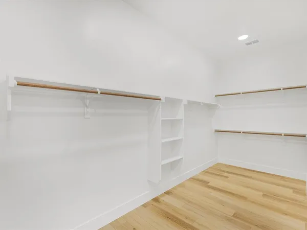 a view of a bathroom with a sink and mirror