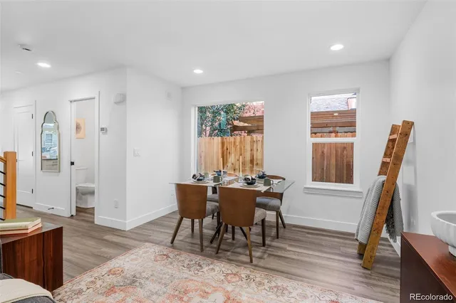 a view of a dining room with furniture window and wooden floor