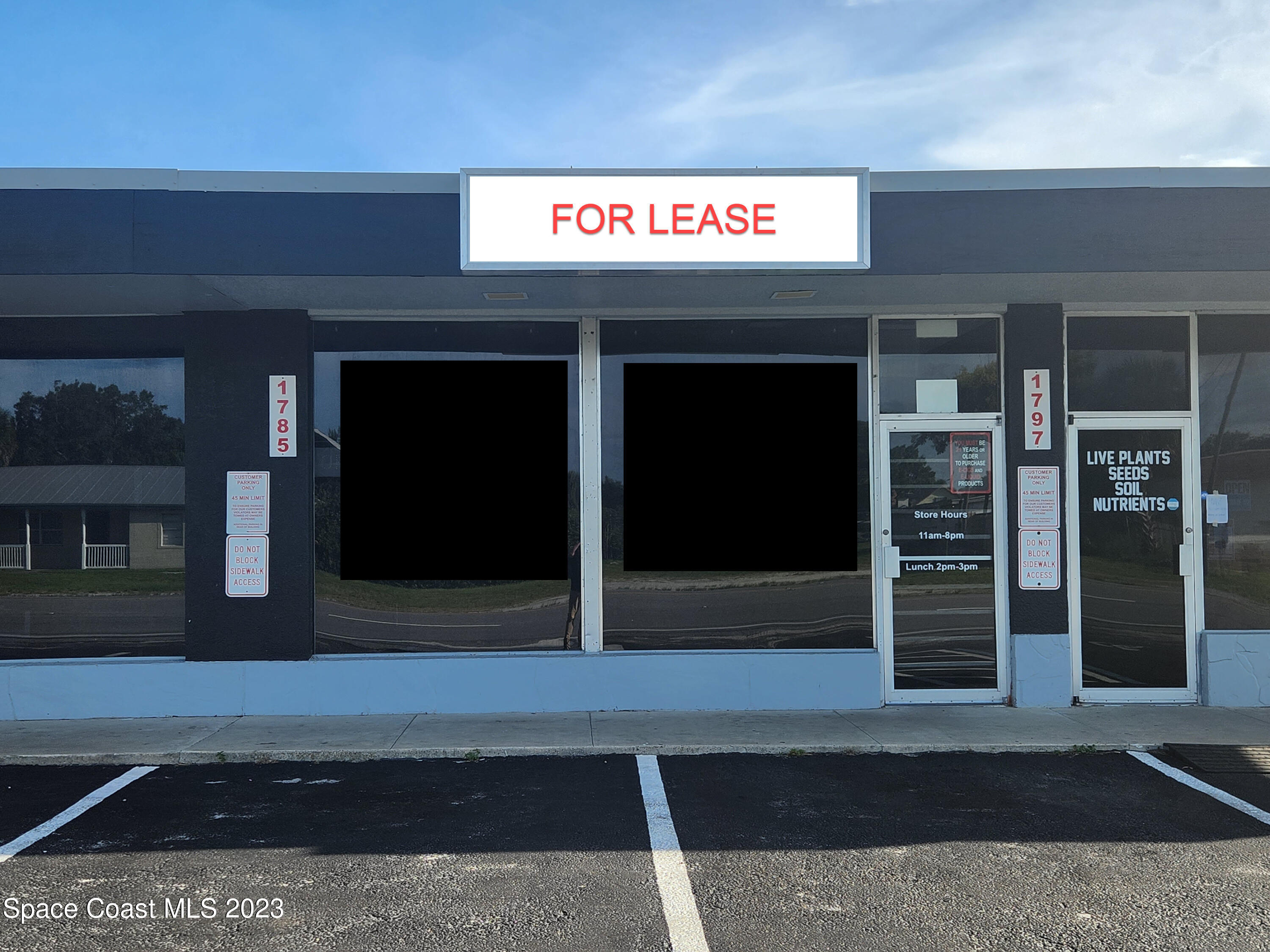 1785 Aurora Road Melbourne, FL 32935 - Photo 1 of 6 a view of a shop in the street
