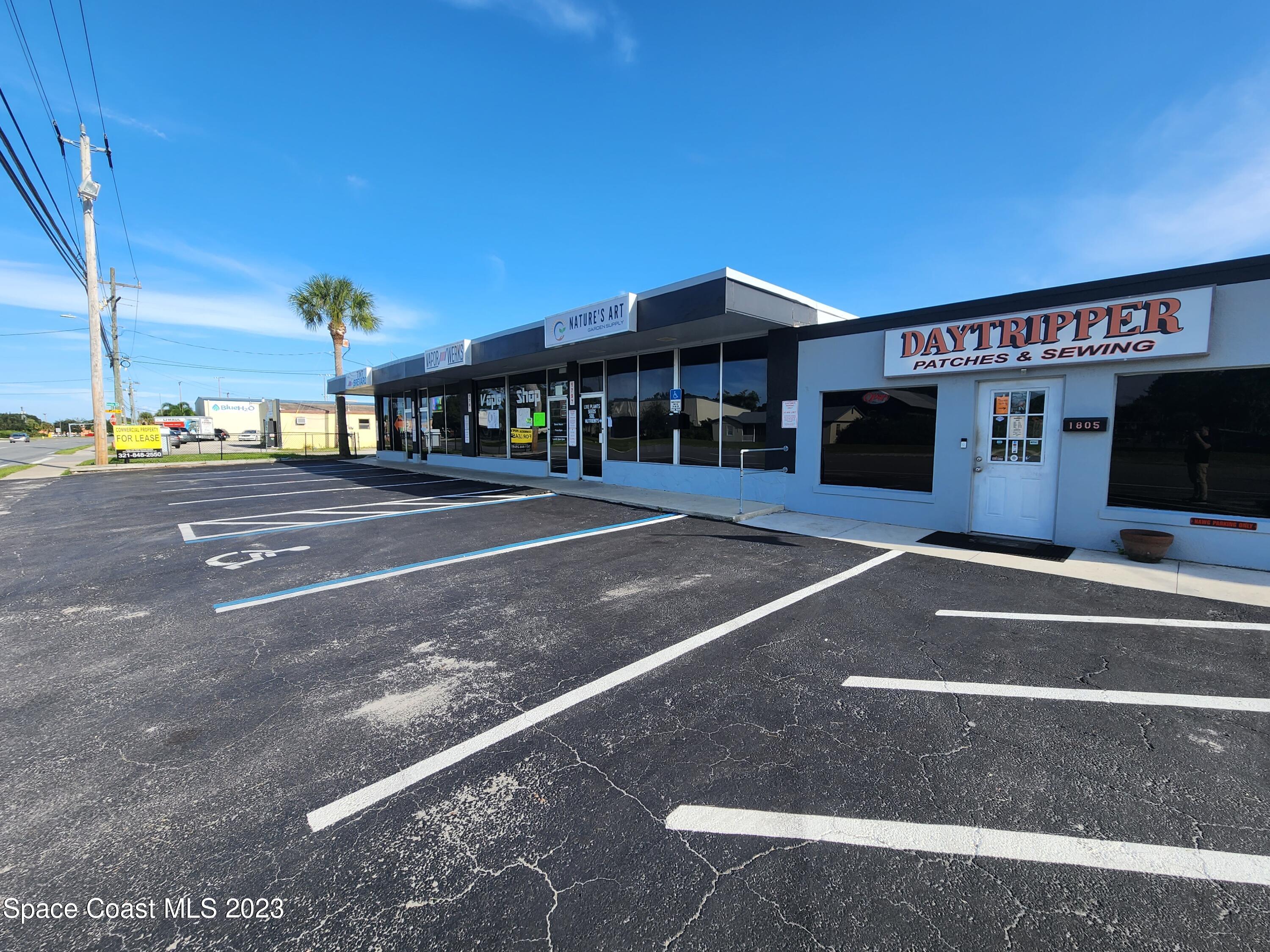 1785 Aurora Road Melbourne, FL 32935 - Photo 3 of 6 a view of a building with a street