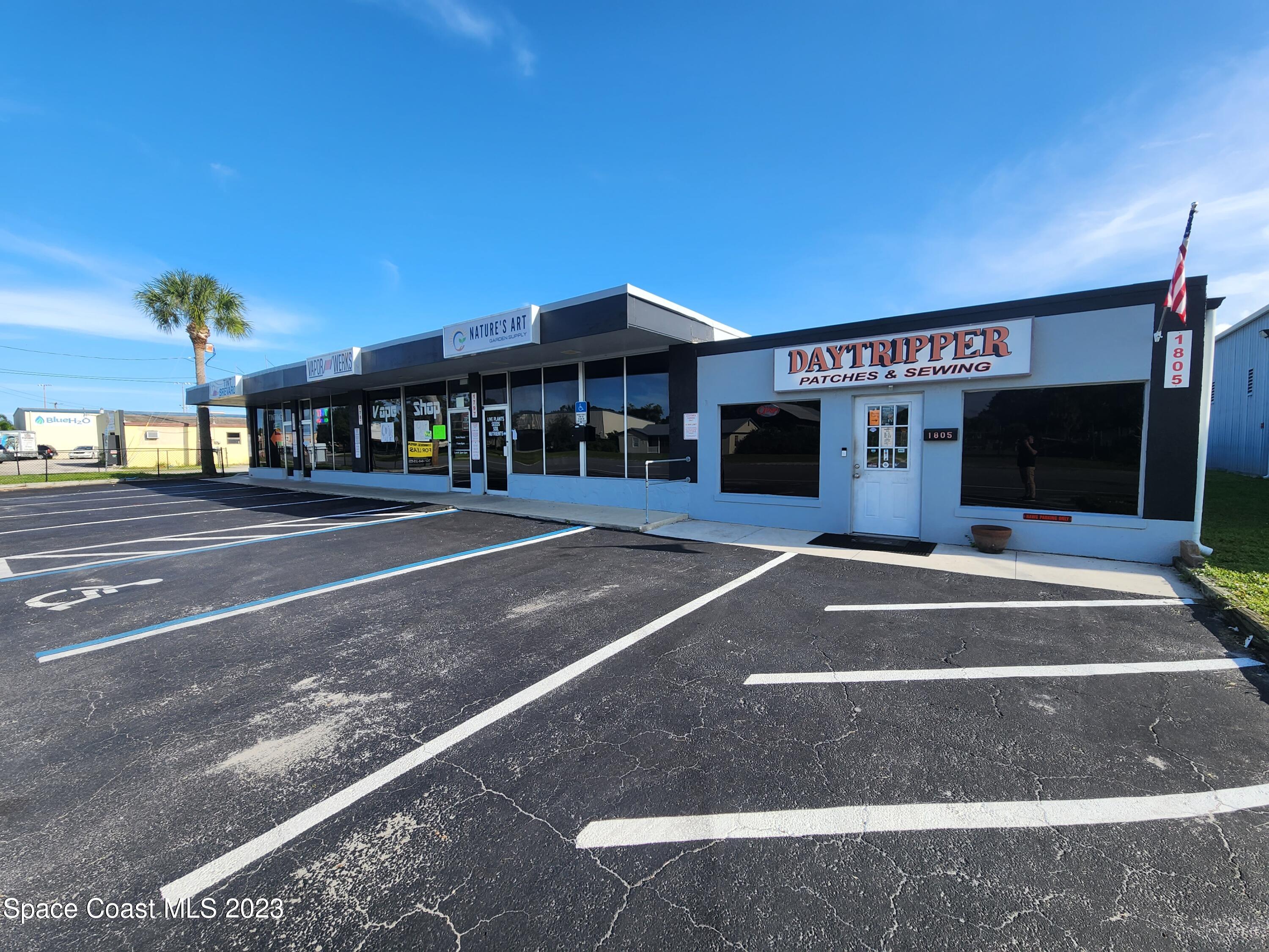 1785 Aurora Road Melbourne, FL 32935 - Photo 5 of 6 a view of a building with a street