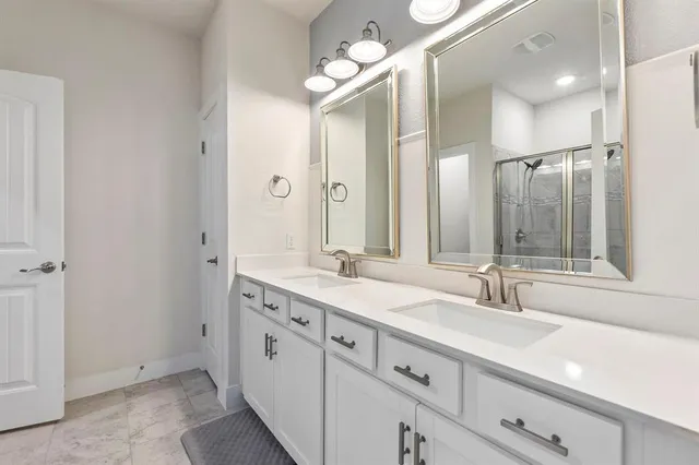 a bedroom with a bed and flat screen tv