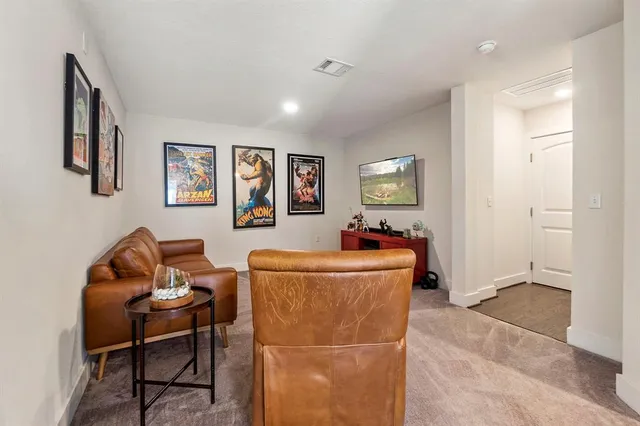 a bathroom with a double vanity sink mirror and next to a window