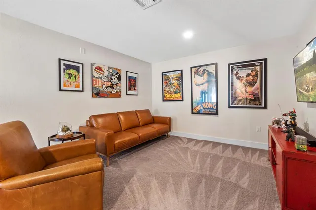 a living room with furniture and window
