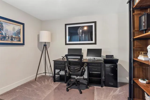 a bedroom with a bed and a mirror