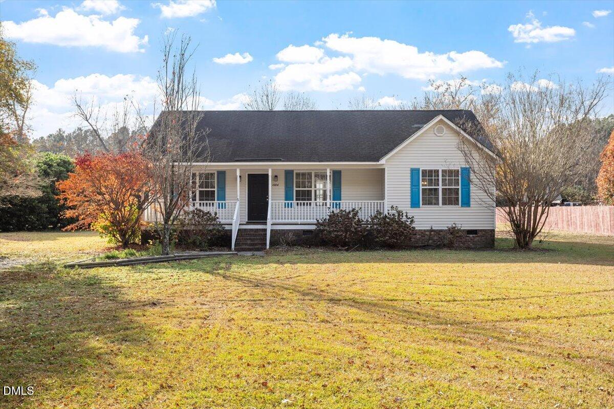 1084 McLemore Road Clayton, NC 27520 - Photo 1 of 34 a view of a house with a swimming pool