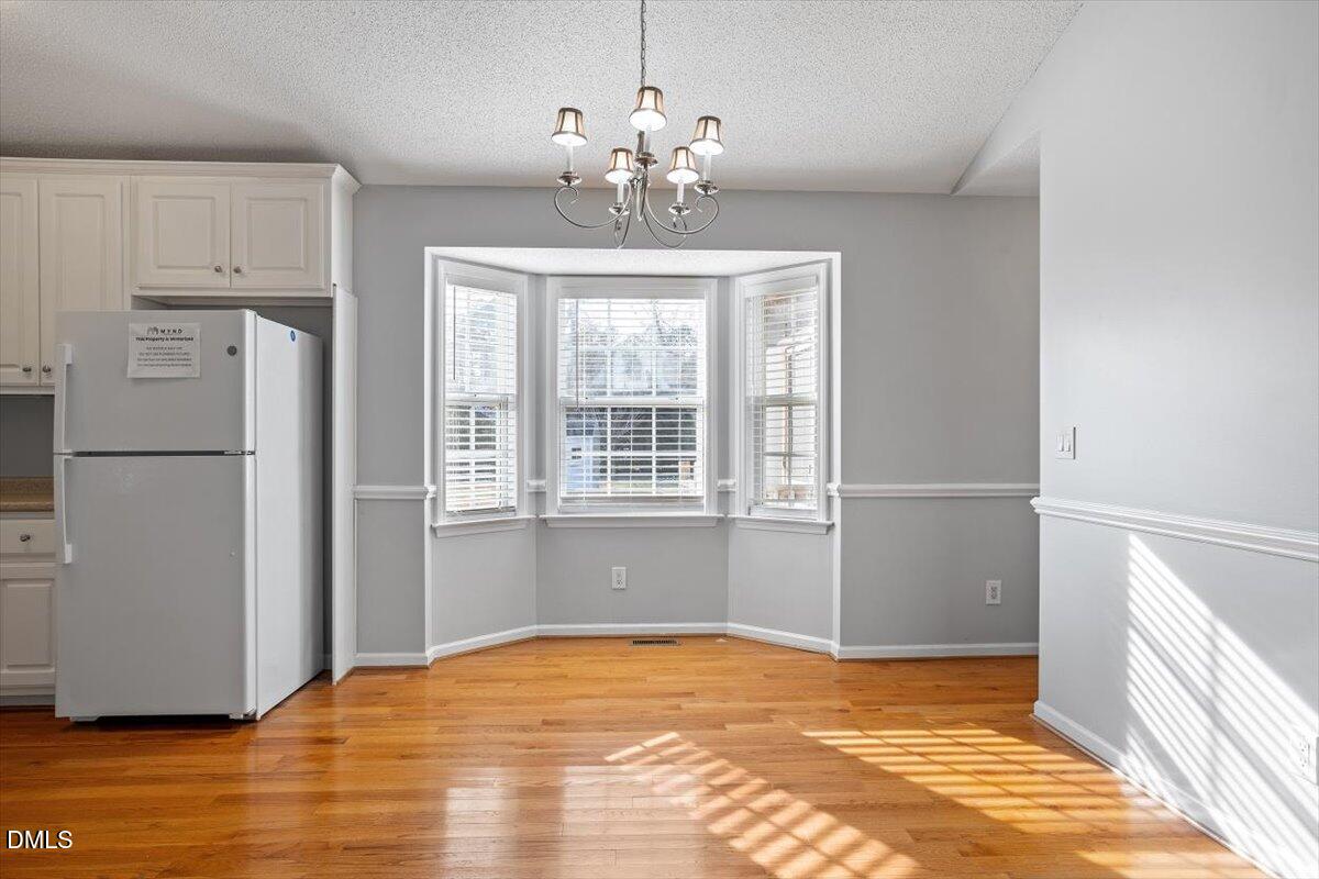 1084 McLemore Road Clayton, NC 27520 - Photo 18 of 34 a view of a livingroom with a chandelier