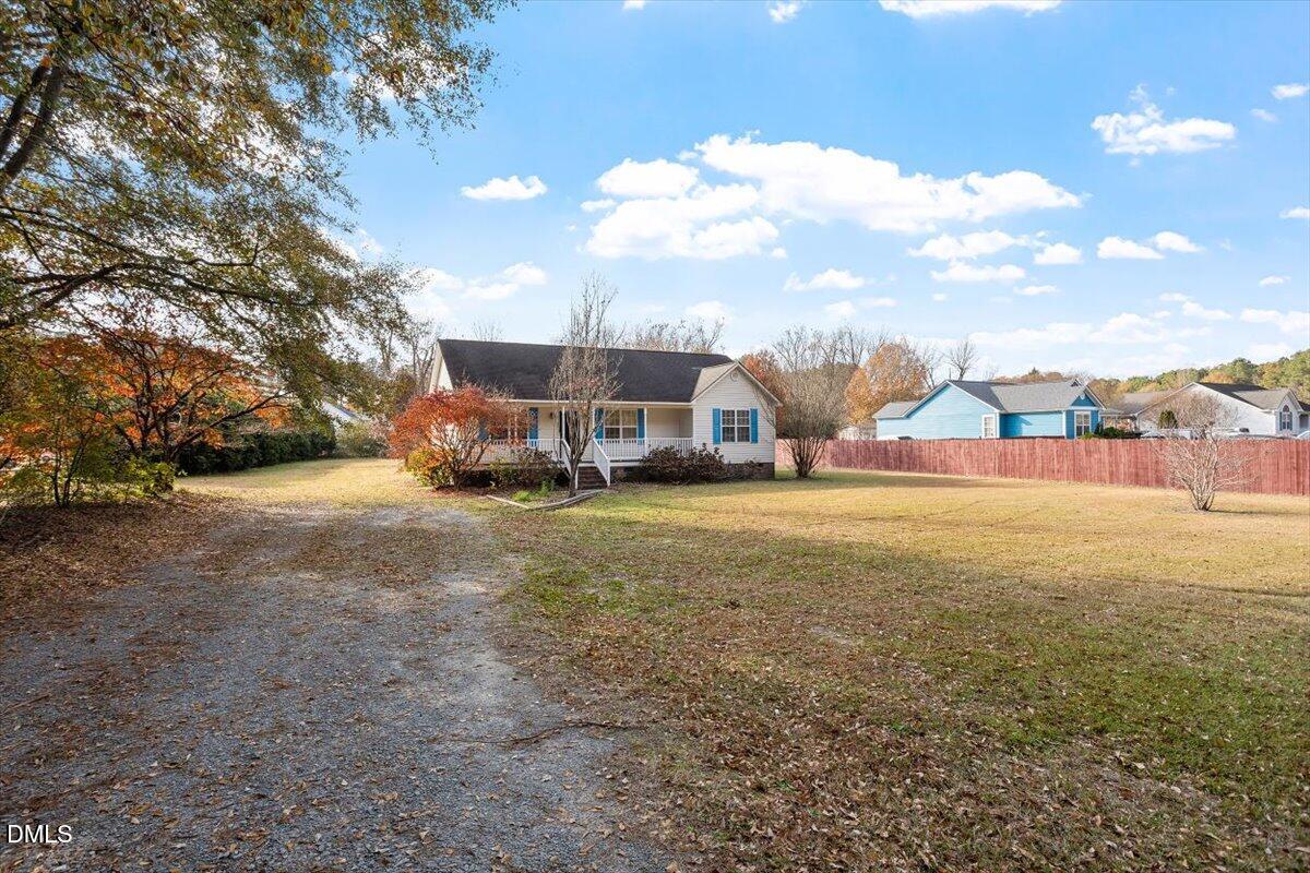 1084 McLemore Road Clayton, NC 27520 - Photo 2 of 34 a view of a street with houses