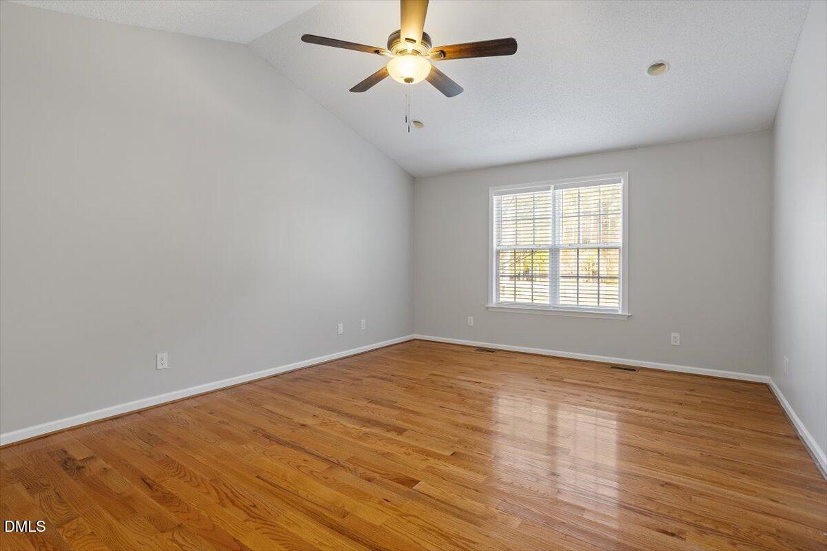 1084 McLemore Road Clayton, NC 27520 - Photo 21 of 34 wooden floor in an empty room with a window
