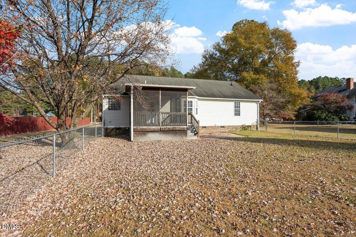 1084 McLemore Road Clayton, NC 27520 - Photo 30 of 34 a house with trees in front of it