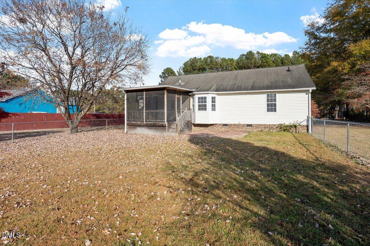 1084 McLemore Road Clayton, NC 27520 - Photo 31 of 34 a view of house with outdoor space and garden