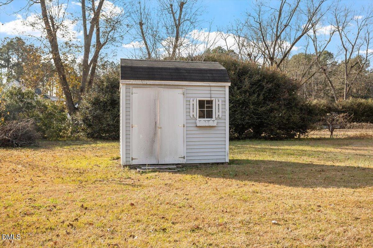 1084 McLemore Road Clayton, NC 27520 - Photo 33 of 34 a view of a house with a yard