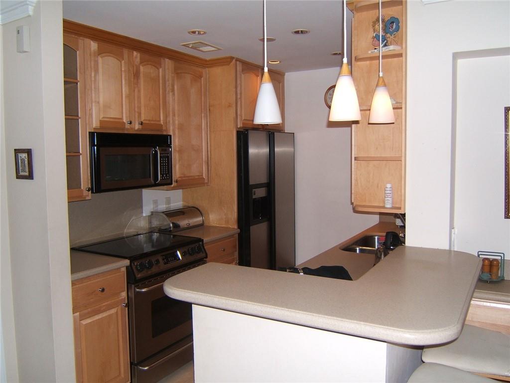 a kitchen with a sink and a refrigerator
