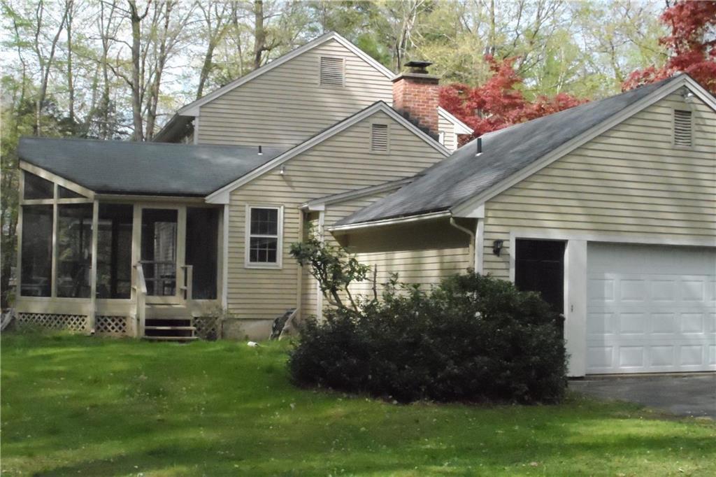 7 Saddle Ridge Drive Simsbury, CT 06092 - Photo 1 of 1 a front view of a house with a garden