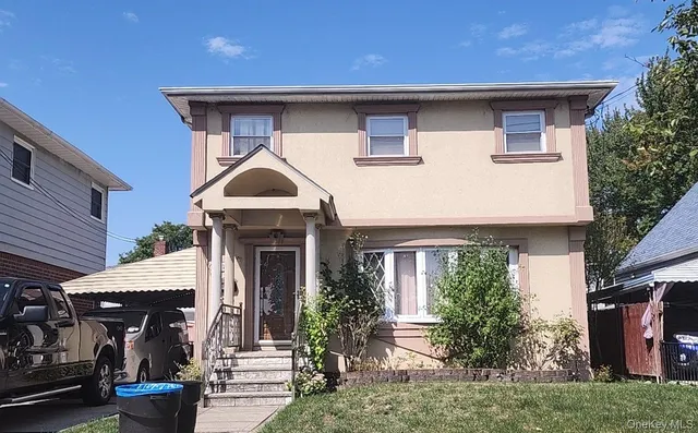 a front view of a house with garden