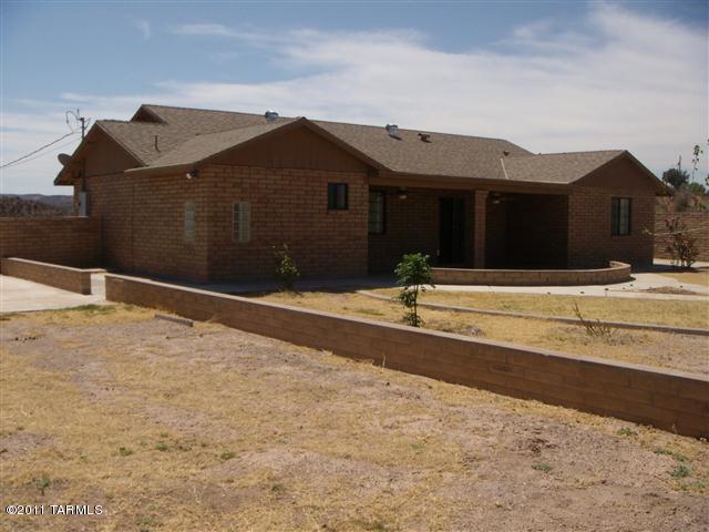 940 Paseo Escoba Rio Rico, AZ 85648 - Photo 24 of 25 a view of the house with a yard