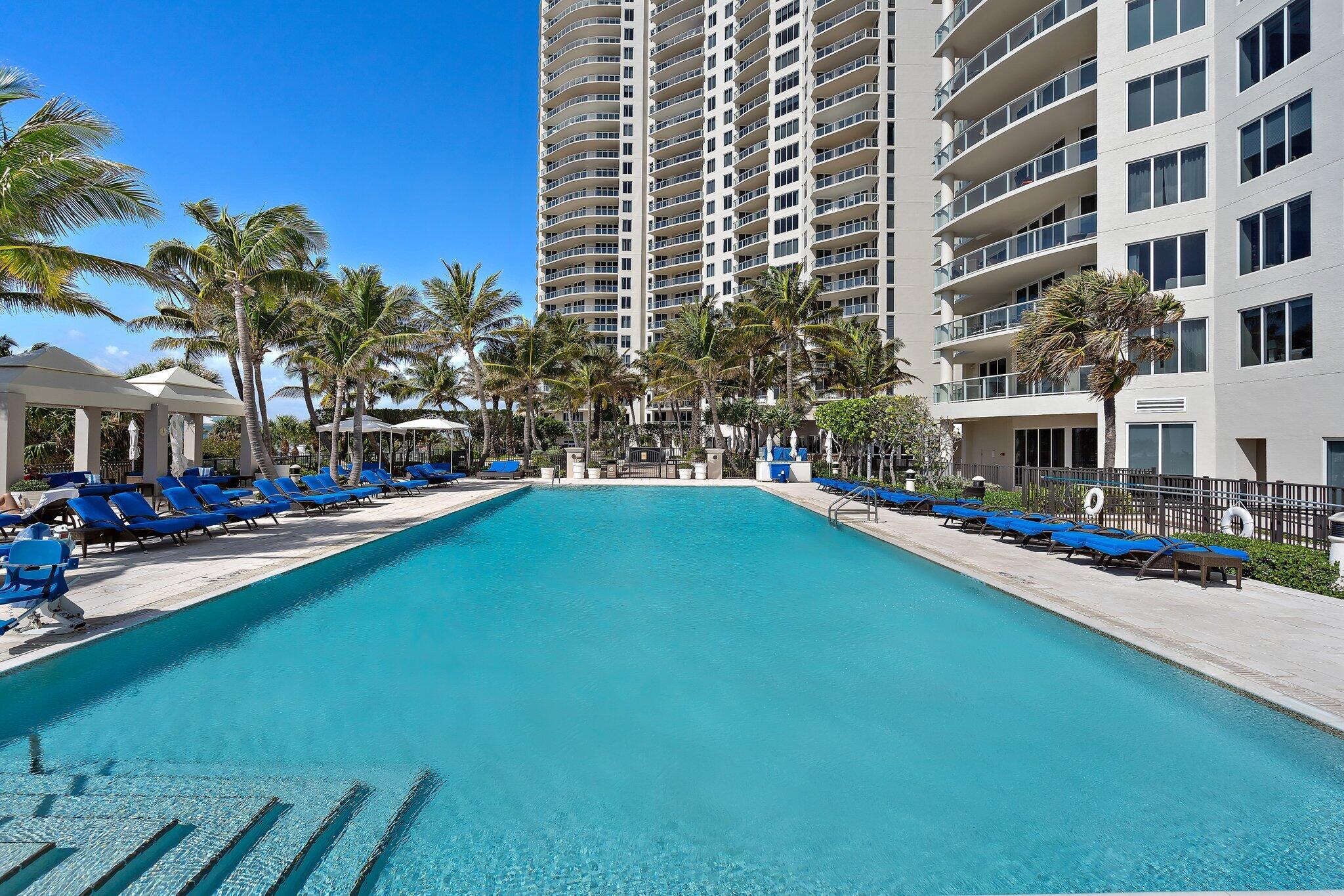 2700 North Ocean Drive, Unit 304B Singer Island, FL 33404 - Photo 26 of 91 a front view of a building with swimming pool having outdoor seating
