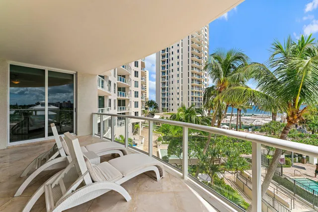 a spacious bedroom with a bed and a couch