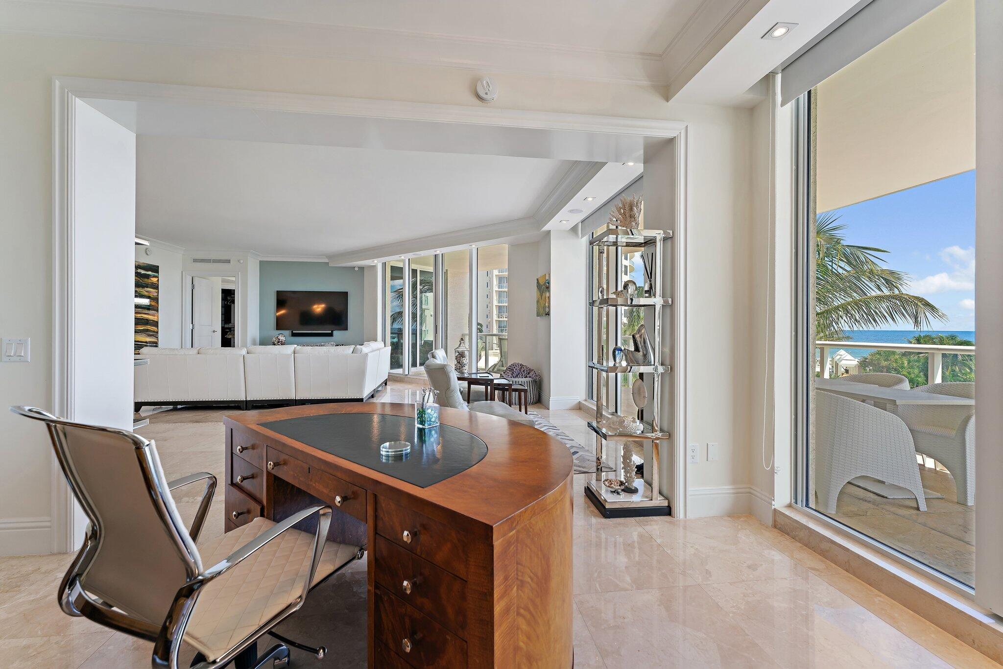 2700 North Ocean Drive, Unit 304B Singer Island, FL 33404 - Photo 70 of 91 a dining room with furniture and a floor to ceiling window