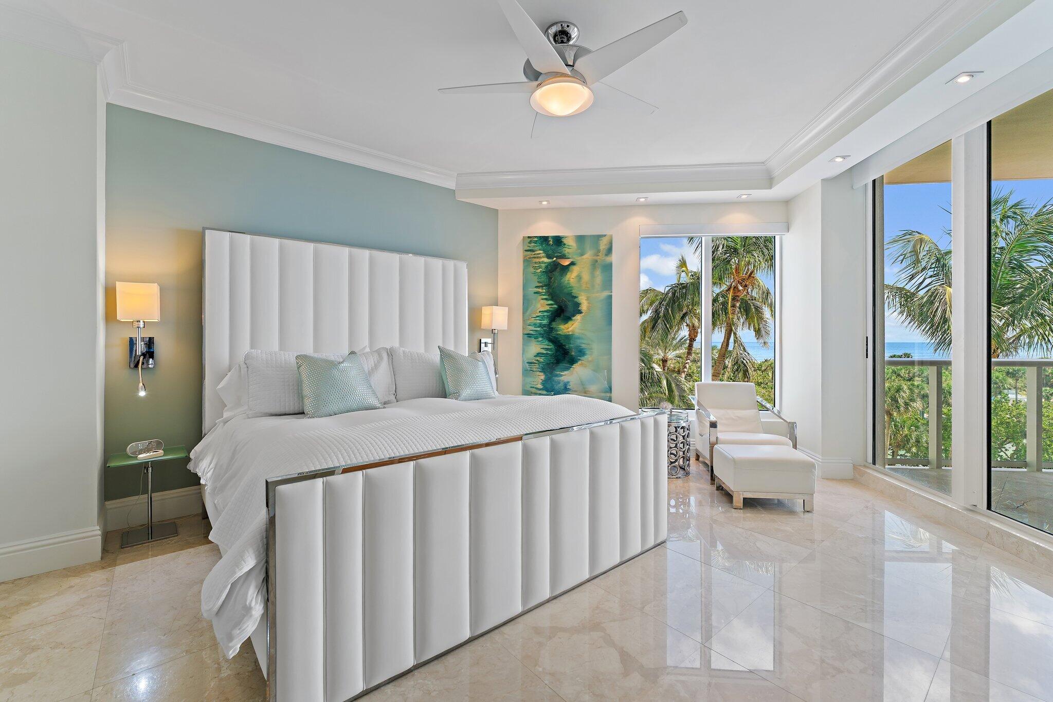 2700 North Ocean Drive, Unit 304B Singer Island, FL 33404 - Photo 75 of 91 a bed sitting in a bedroom next to a large window