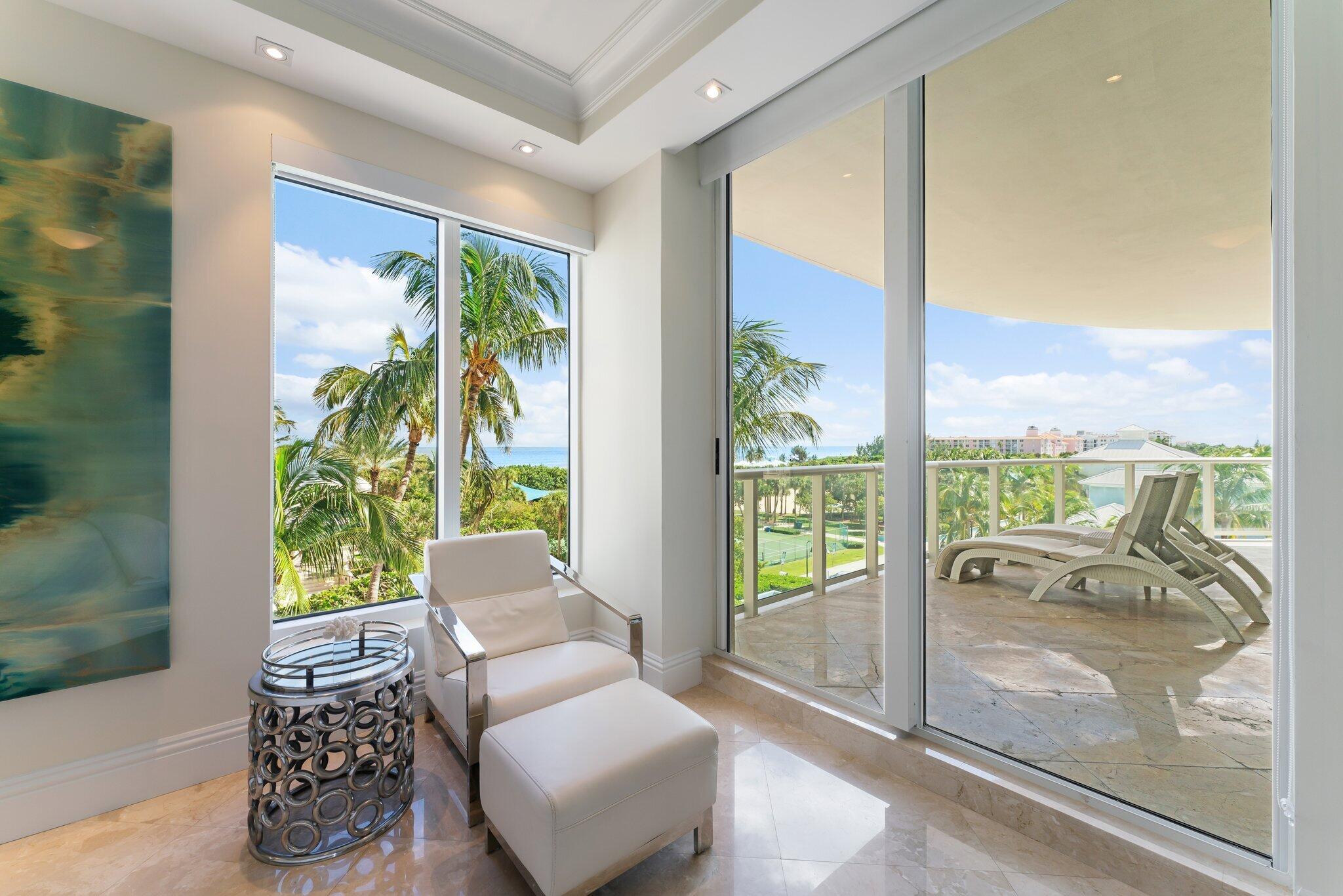 2700 North Ocean Drive, Unit 304B Singer Island, FL 33404 - Photo 76 of 91 a living room with furniture and a floor to ceiling window