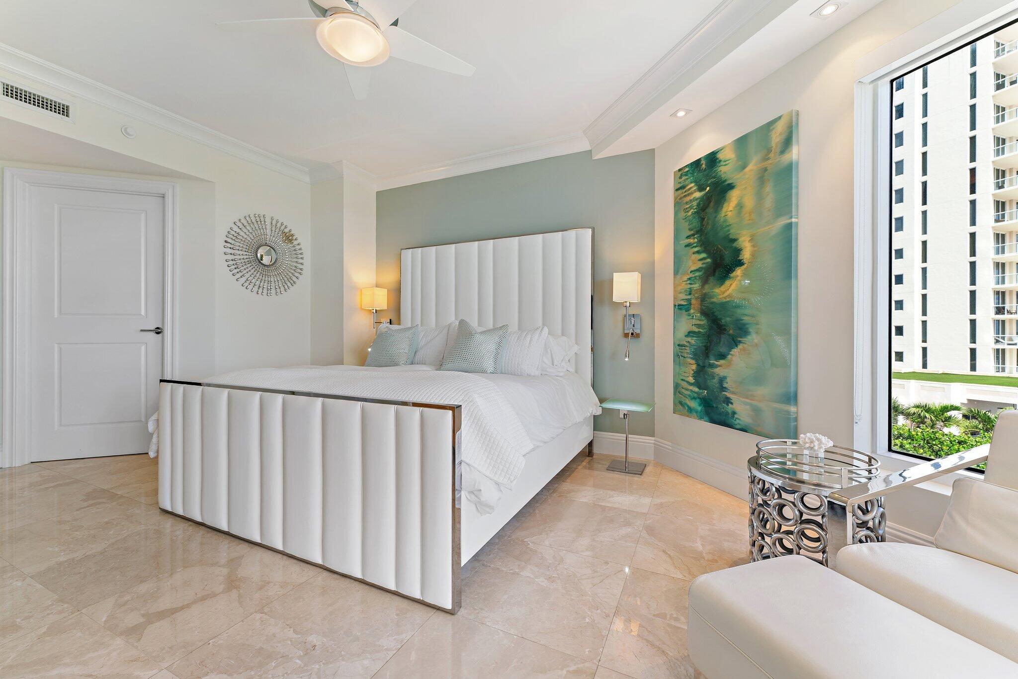 2700 North Ocean Drive, Unit 304B Singer Island, FL 33404 - Photo 78 of 91 a spacious bedroom with a large bed and a window
