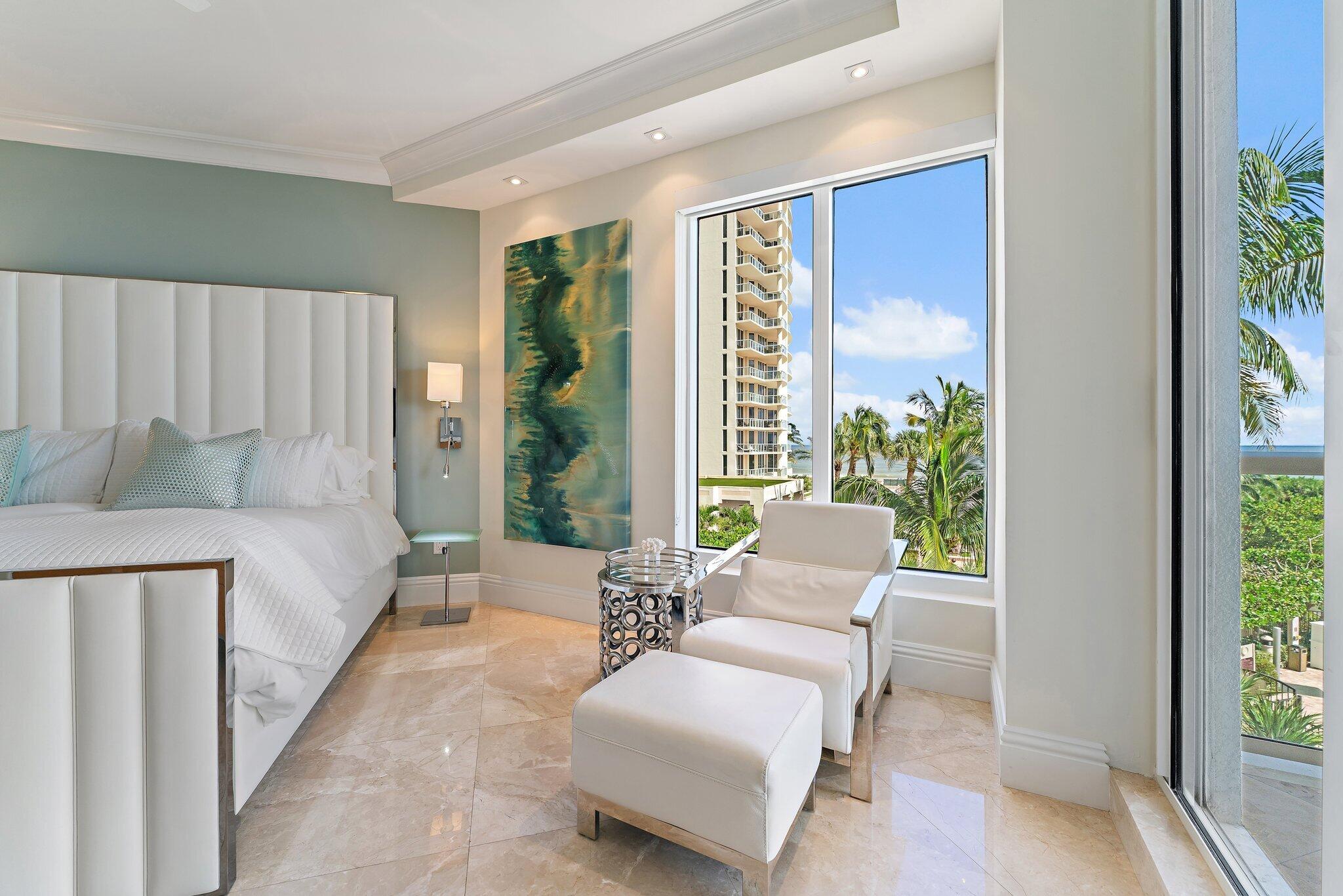 2700 North Ocean Drive, Unit 304B Singer Island, FL 33404 - Photo 79 of 91 a spacious bedroom with a bed and a couch