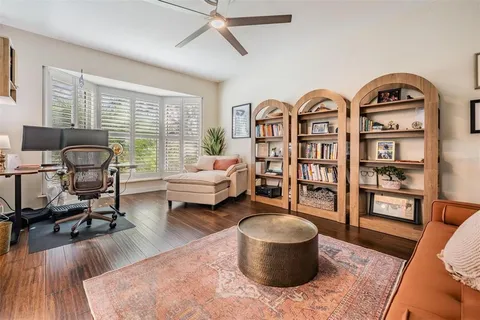 a living room with furniture or couch and a potted plant