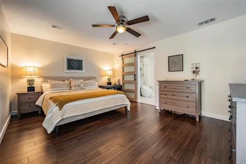 a bedroom with a bed and furniture