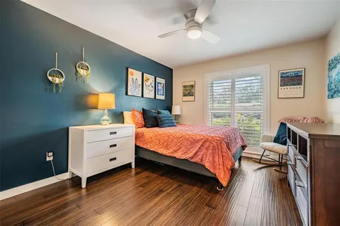 a bed room with a bed and a window