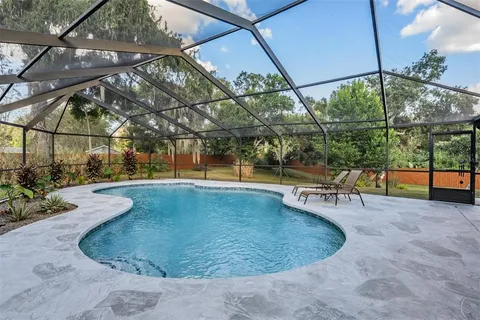 a view of a swimming pool with a patio